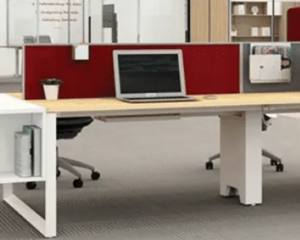 Modern ergonomic office workstation desk with laptop setup and partition workspace by Kokuyo India.